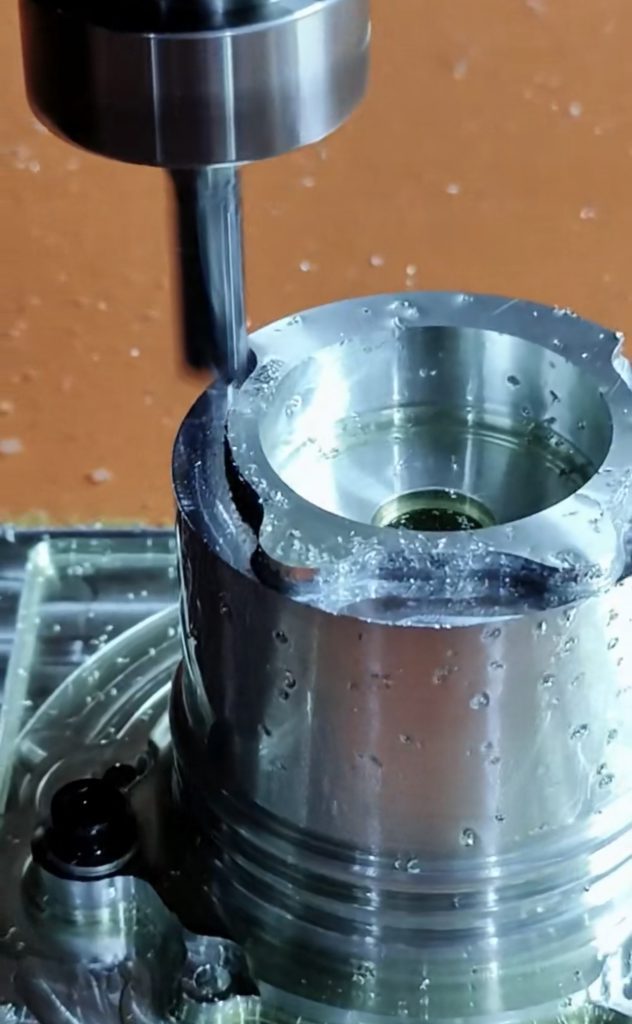 Close-up of CNC machine cutting metal component — optimizing CNC operations with precision tooling.