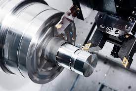 CNC lathe cutting metal part, showing precision and automation in hybrid CNC machining.