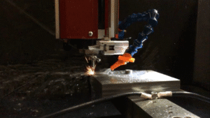 CNC electrochemical milling process with precision cutting, fluid spray, and spark erosion on a metal workpiece