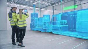 Technicians using augmented reality to inspect AI-driven CNC machines in a smart factory environment.