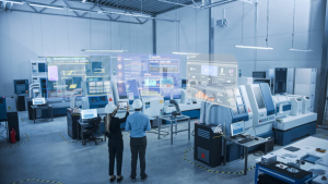 Engineers observing AI-powered CNC machines in a smart factory environment with real-time data overlays & digital interfaces.