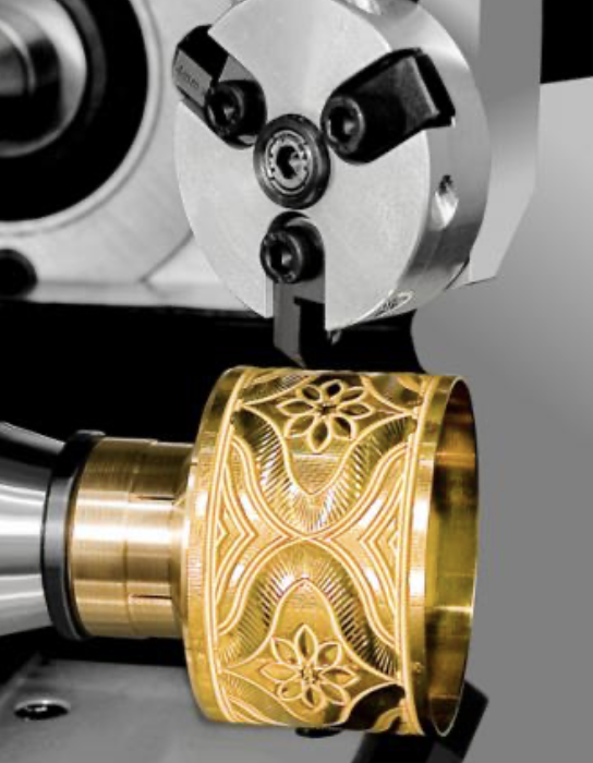CNC engraving machine crafting intricate patterns on gold jewelry